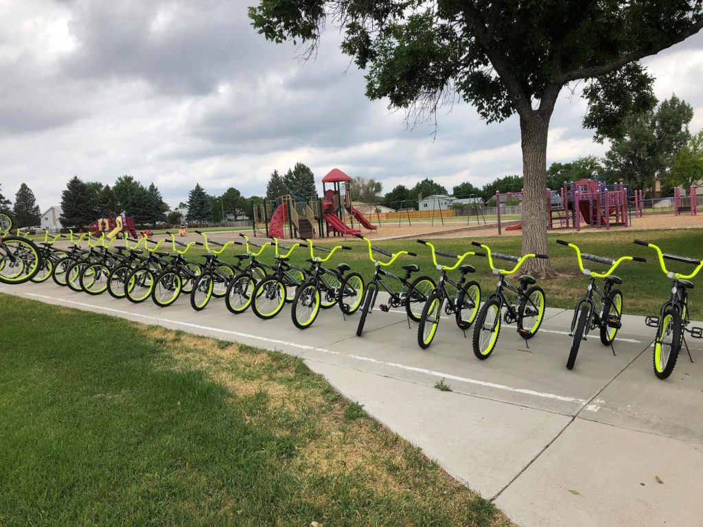 row of black and green children's bikes